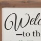 Glitzhome 29.75"H "Welcome to the Porch" Wood Framed Easel Porch Sign with Flowers