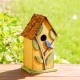 Glitzhome 9.75"H Washed Yellow Distressed Solid Wood Birdhouse with 3D Tree and Bird