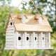 Glitzhome 14.25"L Oversized Washed White Distressed Solid Wood Cottage Birdhouse with Natural Wood Roof