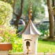 Glitzhome 29.75"H Farmhouse Washed White Distressed Metal Pagoda Birdhouse with Bronze Roof