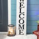 Glitzhome 42.25"H Wooden Reversible "WELCOME/HOHOHO" Snowman Porch Sign