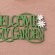 Glitzhome 24"L Metal Cutout "WELCOME TO MY GARDEN"  Wall Decor