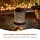 Glitzhome 8.75"H Black Metal Cutout Flower Solar Powered Outdoor Hanging Lantern with LED Light