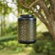 Glitzhome 8.75"H Black Metal Cutout Flower Solar Powered Outdoor Hanging Lantern with LED Light