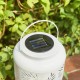 Glitzhome 8.75"H White Metal Cutout Leaf Solar Powered Outdoor Hanging Lantern with LED Light