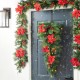 Glitzhome 3ft Pre-Lit Greenery Pine Poinsettia and Red Berries Christmas Teardrop Swag with 50 Warm White Lights and Timer