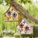 Glitzhome 10.5"H Washed Yellow Distressed Solid Wood Two-Story Townhouse Garden Birdhouse with 3D Flowers