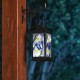 Glitzhome 11"H Stylish Textured Glass with Butterfly and Flower Pattern Solar Powered Hanging Lantern (KD)