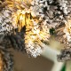 Glitzhome 7.5ft Pre-Lit Flocked Slim Spruce Artificial Christmas Tree with 320 Warm White Lights,3 Function