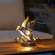 Glitzhome 9.75"H Set of 2 Black and Gold Metal Cutout Flying Hummingbird Silhouette Solar Powered Edison Bulb Outdoor Lantern