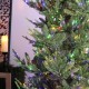 Glitzhome 9ft Pre-Lit Green Upward Slim Fir Artificial Christmas Tree with 700 Warm White and Multi-color LED Lights, 9 funciton w/ Foot Pedal and Remote Control, Simple Setup