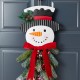 Glitzhome 25"H Greenery Snowman Door Hanger