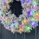 Glitzhome 24"D Pre-Lit Snow Flocked Greenery Pine Christmas Wreath,with 50 White/Multi-color C3 Clear LED Lights and Timer,8 Function