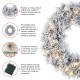 Glitzhome 24"D Pre-Lit Snow Flocked Greenery Pine Christmas Wreath,with 50 White/Multi-color C3 Clear LED Lights and Timer,8 Function
