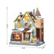 Glitzhome 10.25"H Lighted Christmas Donuts & Coffee Shop Resin Village with Movement and Music