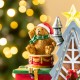 Glitzhome 10.75"H Lighted CHRISTMAS TOY MARKET Resin Village with Movement and Music