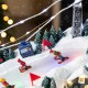 Glitzhome 16"H Christmas Oversized Resin Lighted Musical Skiing Table Village Decor