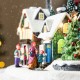 Glitzhome 16"H Christmas Oversized Resin Lighted Musical Skiing Table Village Decor