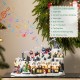 Glitzhome 16"H Christmas Oversized Resin Lighted Musical Skiing Table Village Decor