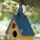 Glitzhome 12.25"H Washed Yellow Distressed Solid Wood Cottage Garden Birdhouse with Bees and Flowers
