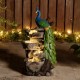 Glitzhome 20.5"H 4-Tierd Peacock w/Stacked Stone Polyresin Outdoor Fountain with Pump and LED Light (KD)