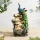 Glitzhome 20.5"H 4-Tierd Peacock w/Stacked Stone Polyresin Outdoor Fountain with Pump and LED Light (KD)