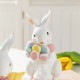 Glitzhome Set of 2 Easter Resin Bunny Holding Macaron Table Decor