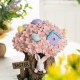Glitzhome 8"H Easter Resin Bunny & Pink Blossoms Table Decor