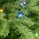 Glitzhome 6ft Pre-Lit Green Slim Fir Artificial Christmas Tree with 300 Warm White and Multi-Color Twinkling Lights, 10 Function with Foot Pedal and Remote