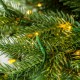Glitzhome 7.5ft Pre-Lit Green Slim Fir Artificial Christmas Tree with 1400 Warm White and Multi-Color Chasing and Twinkling Lights, 9 Function with Foot Pedal and Remote
