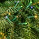 Glitzhome 11ft Pre-Lit Green Slim Fir Artificial Christmas Tree with 2700 Warm White and Multi-Color Chasing and Twinkling Lights, 9 Function with Foot Pedal and Remote